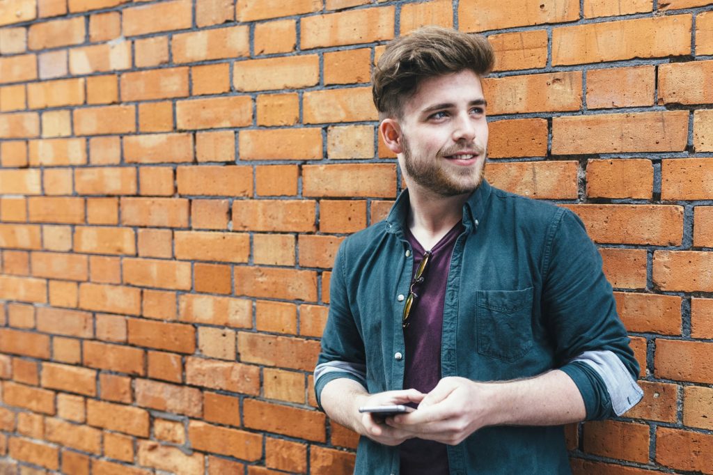 Portrait of young man with cell phone